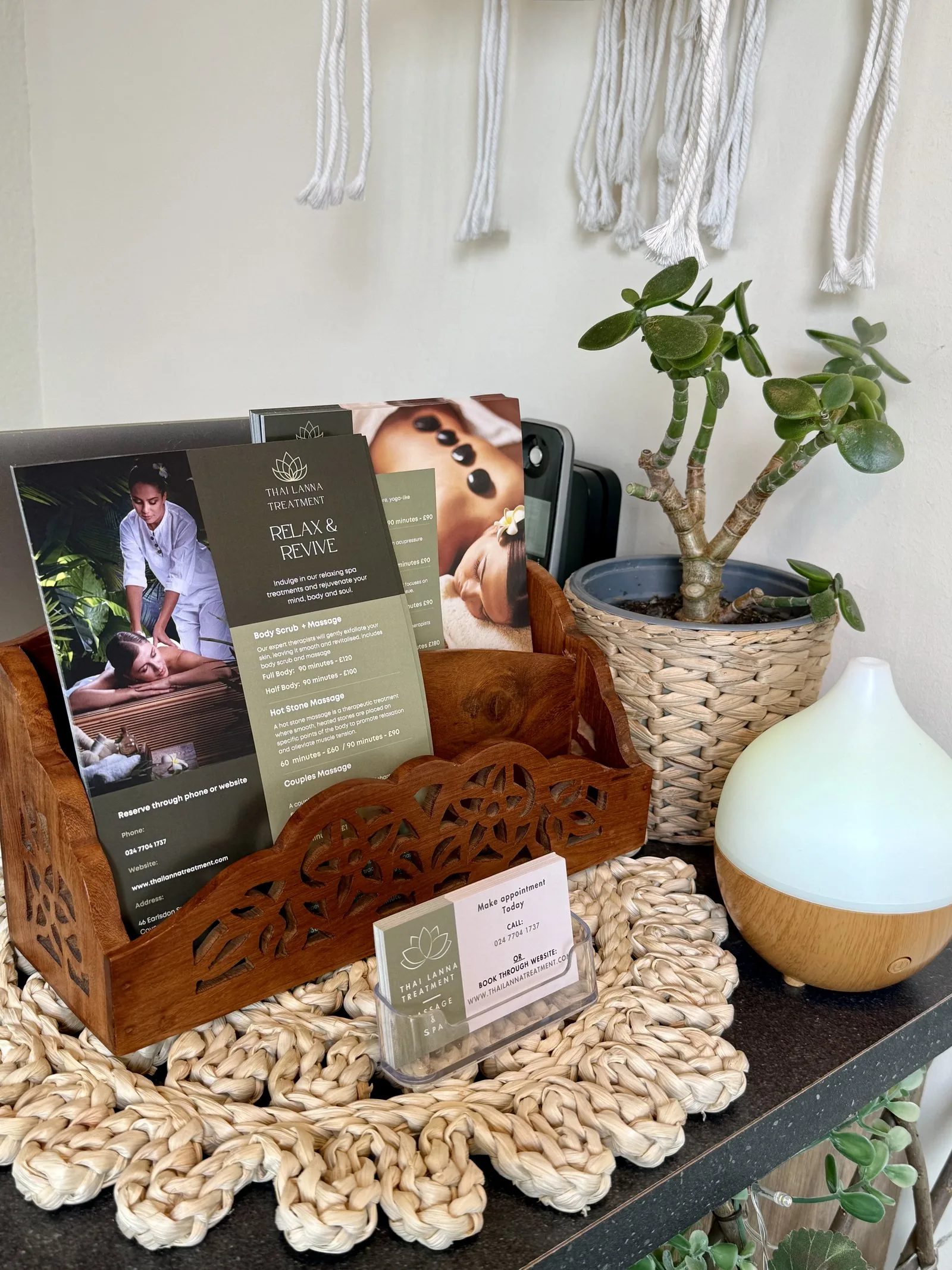 Thai Lanna Treatment leaflets, business cards and plants at the reception area